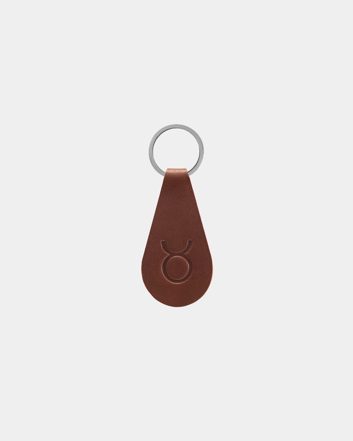 Brown leather key chain with a zodiac sign